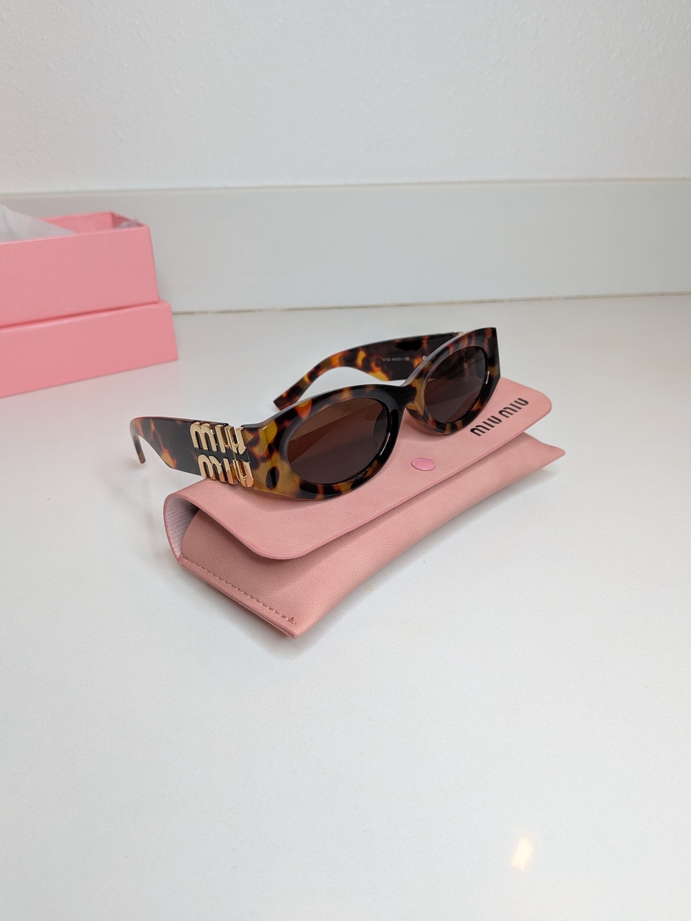Miu Miu Tortoise Oval Sunglasses Gold Logo